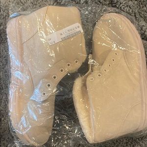 Tan boots still in packaging